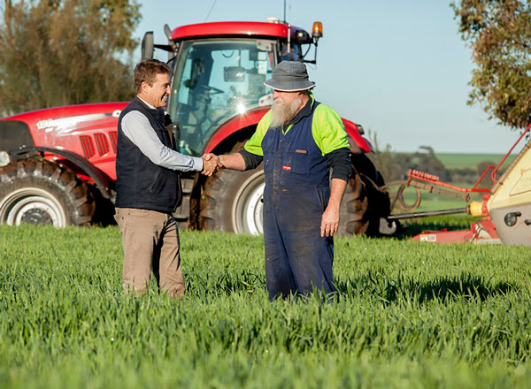 Andrew Newland shakes hands with South Australian farmer
